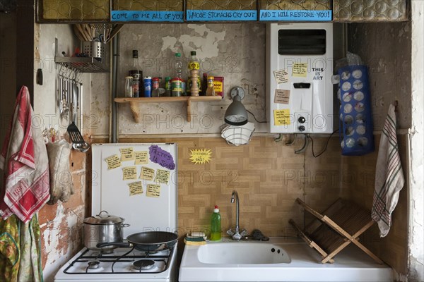 A small messy kitchen in an old French farmhouse