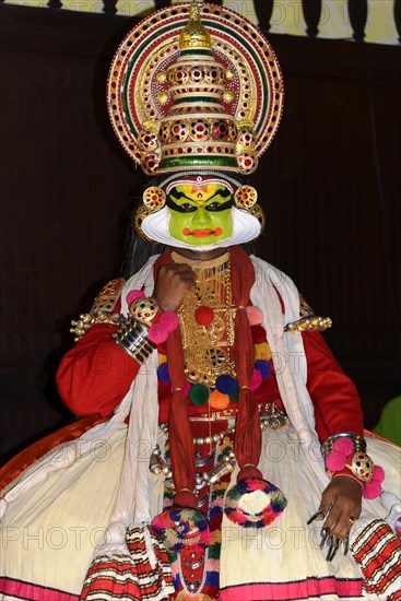 Fully made-up and costumed Kathakali dancer during a performance