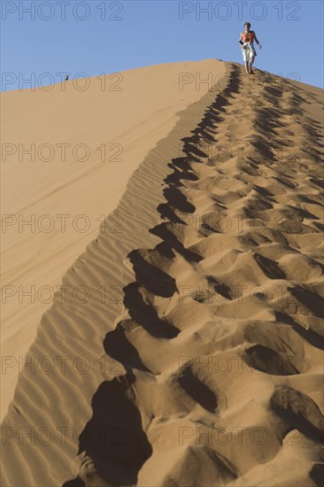 Tourists walking in the sand of Dune 45