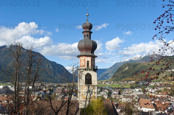 View over the town towards Ahrntal valley with the steeple of the Rain Church of St. Catherine