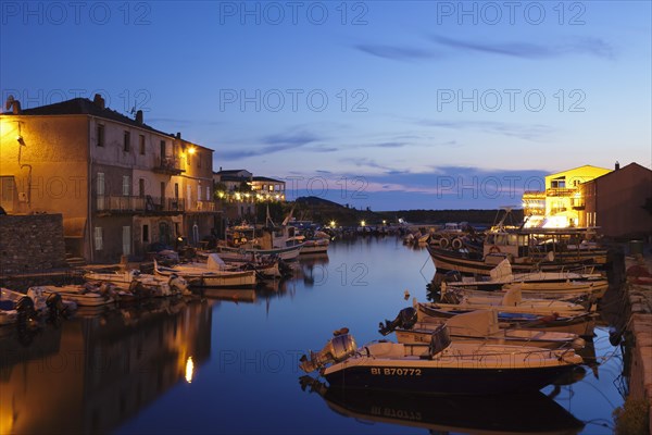 Boats in the harbor at dusk