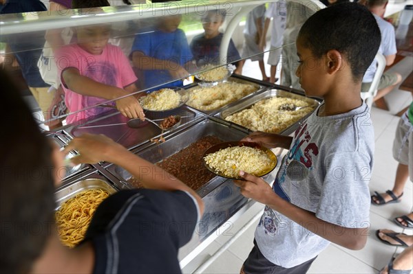 Brazilian boys at the food counter in a social project for street children