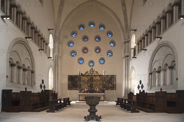 Old choir with baroque high altar and baptismal font