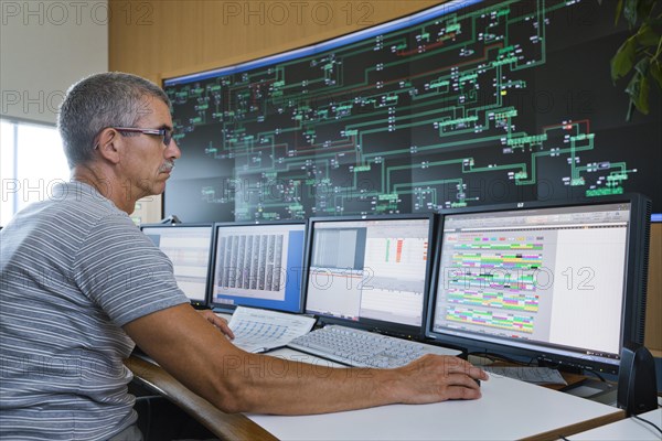 Engineer sitting at his work station in the Transmission Control Center