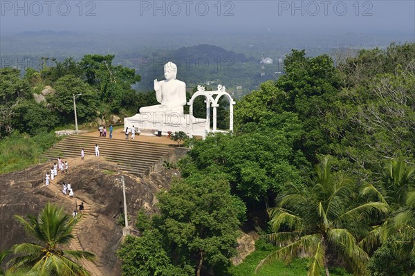 Buddha statue in the lotus position in the Buddhist monastery of Mihintale