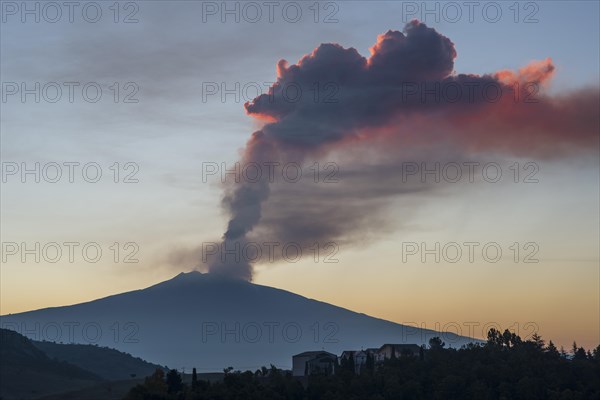 Eruption column above the new southeast crater at sunrise