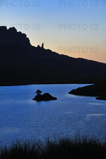 View at dusk across Loch Fada to The Storr with the Old Man of Storr pinnacle