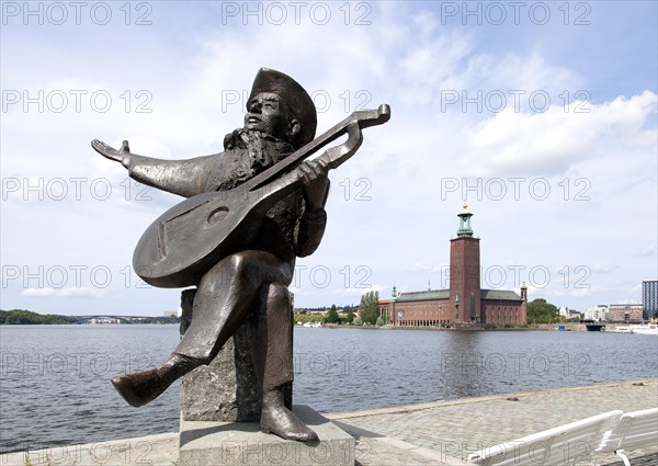 Sculpture of a lute player in front of Stockholm City Hall