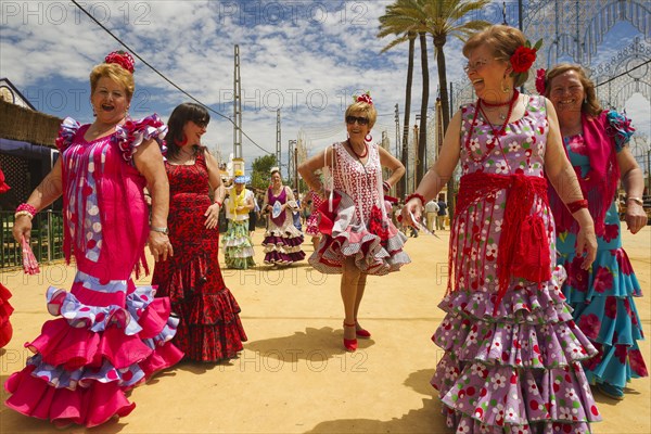 Women wearing gypsy dresses at the Feria del Caballo