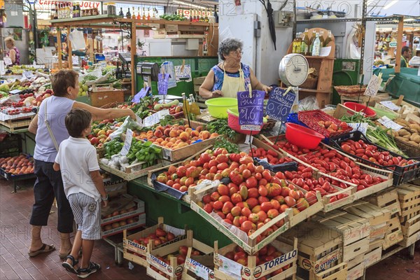 Market stall with fruit and vegetables in the market hall of Sanremo
