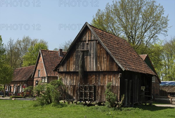 Barn on pillars with stone slabs to protect the grain from mice