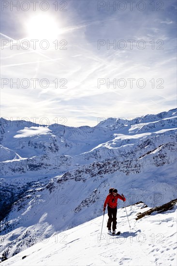 Cross-country skier ascending Kalfanwand Mountain in the Martell Valley