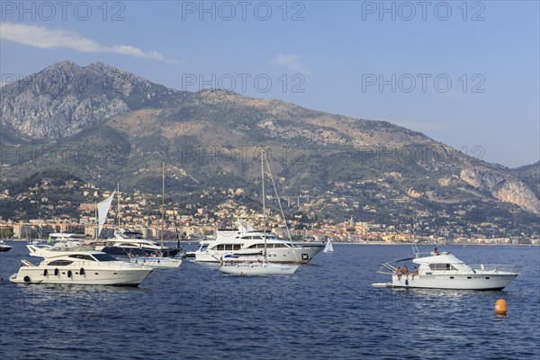 Motor yachts and sailboats moored off the coast of Roquebrune-Cap-Martin