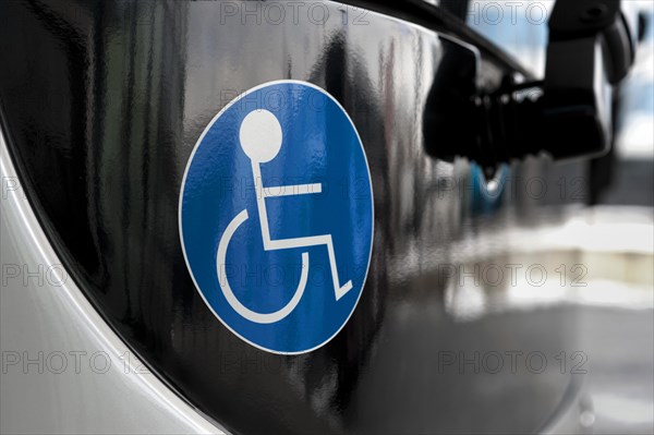 Sticker indicating that a bus is accessible for handicapped people