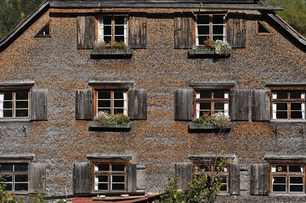 200 year old farmhouse with a shingled facade