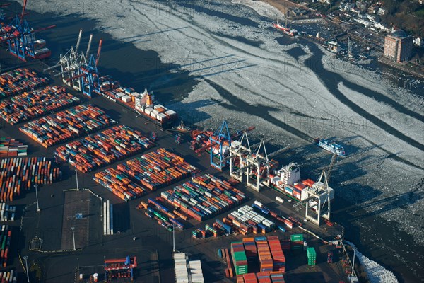 HHLA Container Terminal Burchardkai in winter with ice on the Elbe