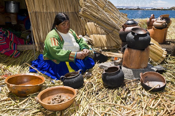 An elderly woman of the Uro Indians wearing typical attire