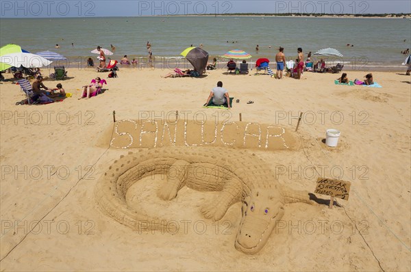 Sand sculpture of a crocodile