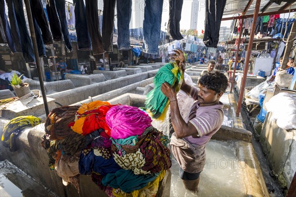 Labourer washing clothes at Mahalaxmi Dhobi Ghat