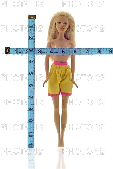Doll being measured