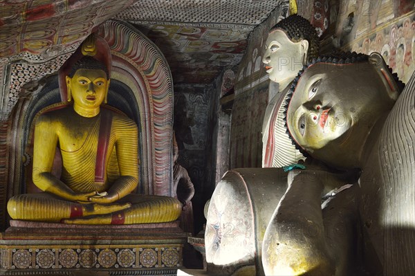 Buddha statues and murals in one of the cave temples of the Golden Temple