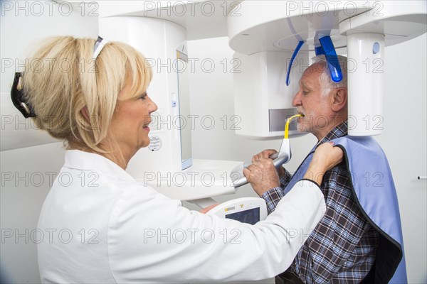 Man being prepared for an X-ray of his teeth