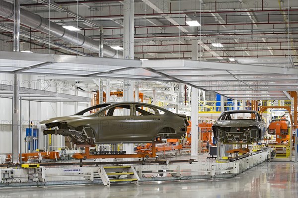 Car bodies move along a conveyor in the paint shop at Chrysler's Sterling Heights Assembly Plant which produces the Chrysler 200