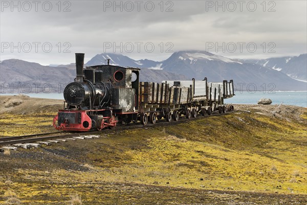 Historic mine train in front of the Kongsfjorden