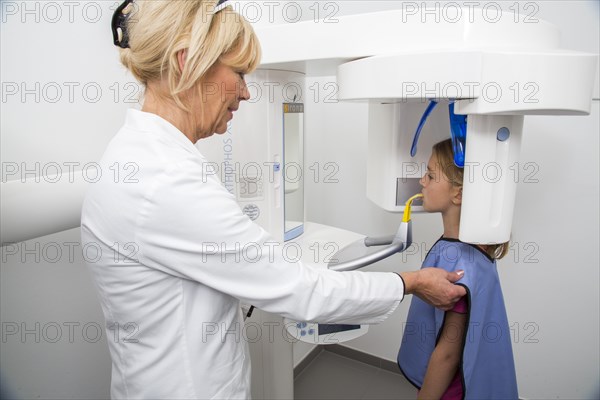Girl being prepared for an x-ray of her teeth
