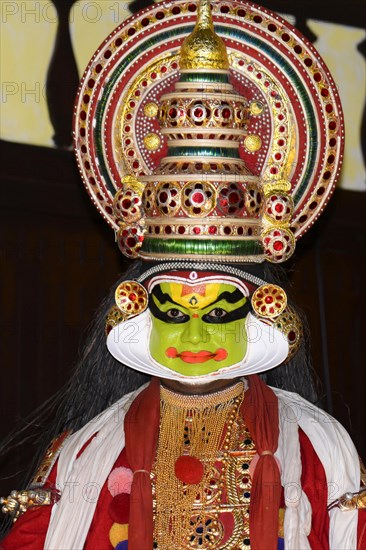 Fully made-up and costumed Kathakali dancer during a performance