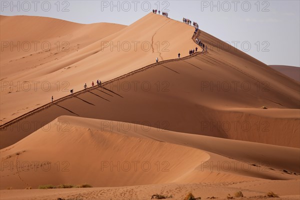 Tourists climbing the Sossusvlei Dunes