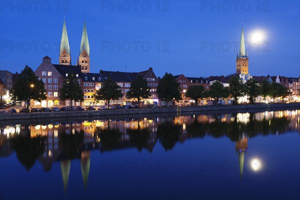 Trave river and the historic centre at full moon