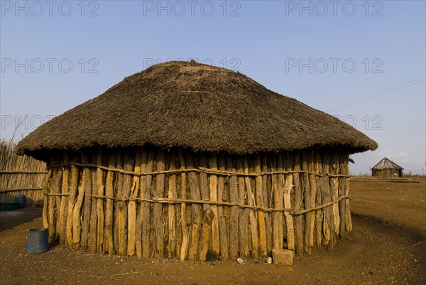 Round hut made of tree trunks
