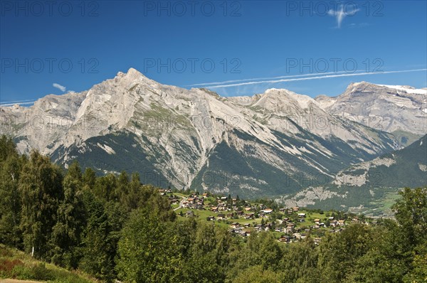 View from Haute-Nendaz over the Rhone Valley towards the summit of Haut de Cry Mountain in the Bernese Alps