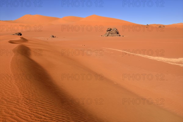 Sand dunes and rocks at Tin Merzouga