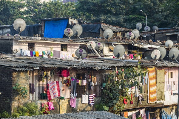 A slum area with houses made from corrugated iron sheets