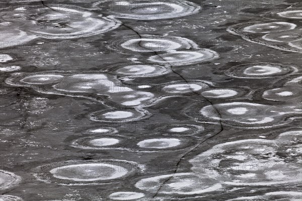 Crack in an ice surface with annular structures