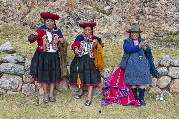 Three elderly women wearing hats