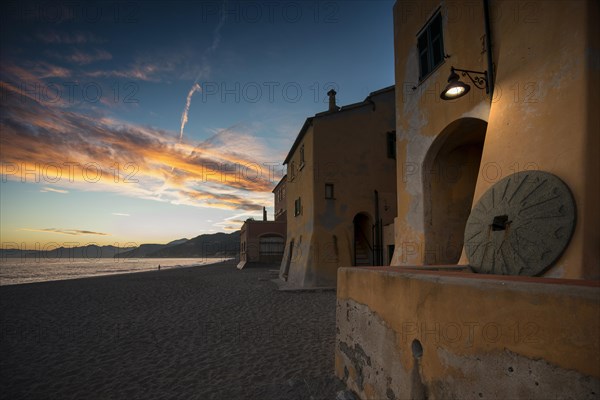 Typical houses on the beach in the evening