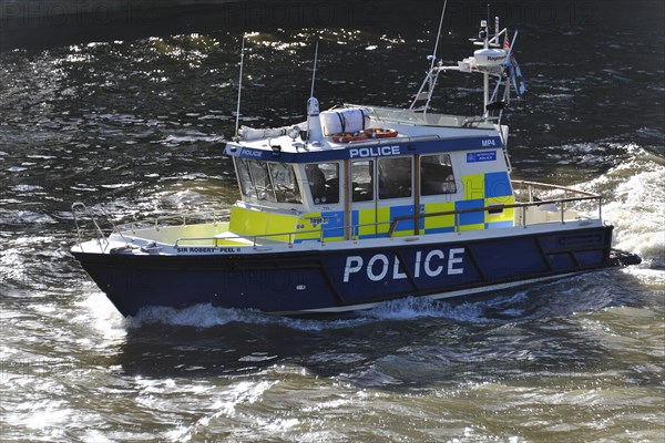 Police boat on patrol on the River Thames