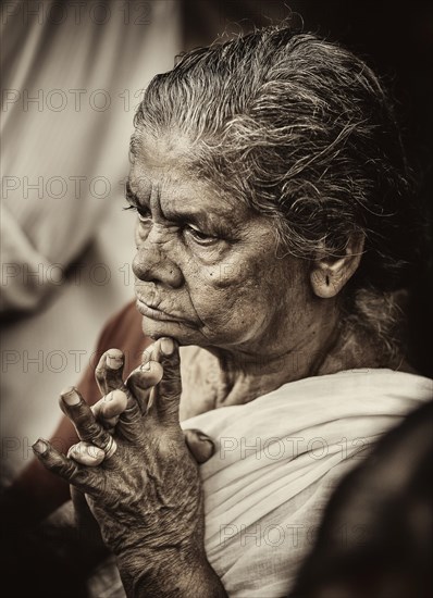 Praying woman at Hindu temple festival