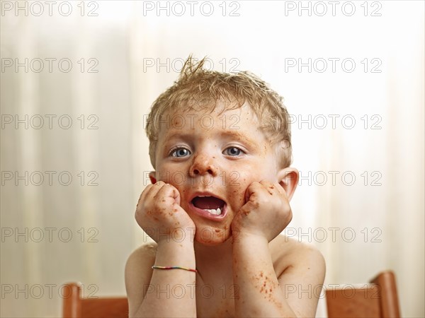 Toddler with a sauce-smeared face