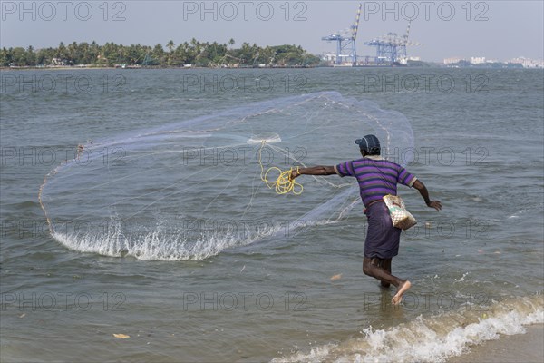 A fisherman throwing his net