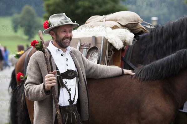 Farmer with pack horses