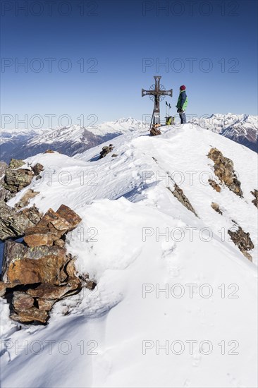 Climber on the summit of Mt Penser Weisshorn
