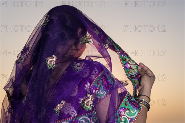 Woman wearing a purple sari