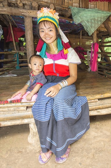 Long-necked woman with her baby