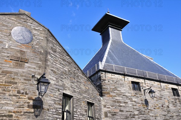Building with the typical tower of a whiskey distillery