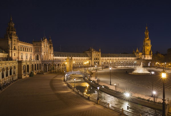 The illuminated Plaza de Espana at dusk