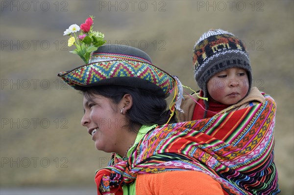 Young woman with child in a sling